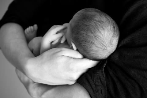 To hold in one’s arms. The Thai for "to hold in one’s arms" is "อุ้ม".