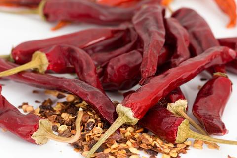 Dried chili. The Thai for "dried chili" is "พริกแห้ง".