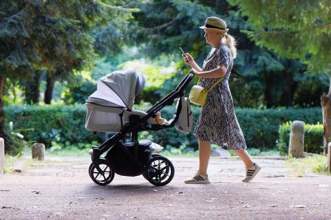 A woman and a stroller. The Thai for "a woman and a stroller" is "ผู้หญิงและรถเข็นเด็ก". A woman and a stroller. The Thai for "a woman and a stroller" is "ผู้หญิงและรถเข็นเด็ก".