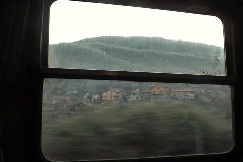 A train window. The Thai for "a train window" is "หน้าต่างรถไฟ".