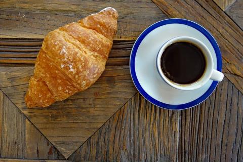 A croissant and a cup of coffee. The Thai for "a croissant and a cup of coffee" is "ครัวซองส์หนึ่งชิ้นกับกาแฟหนึ่งถ้วย". A croissant and a cup of coffee. The Thai for "a croissant and a cup of coffee" is "ครัวซองส์หนึ่งชิ้นกับกาแฟหนึ่งถ้วย".
