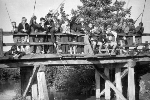 Children fishing on a wooden bridge. The Thai for "children fishing on a wooden bridge" is "เด็กๆตกปลาบนสะพานไม้". Children fishing on a wooden bridge. The Thai for "children fishing on a wooden bridge" is "เด็กๆตกปลาบนสะพานไม้".