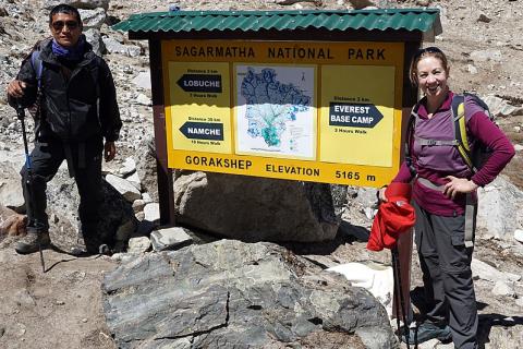 A female hiker with her guide. The Thai for "a female hiker with her guide" is "นักเดินป่าหญิงกับไกด์ของเธอ". A female hiker with her guide. The Thai for "a female hiker with her guide" is "นักเดินป่าหญิงกับไกด์ของเธอ".
