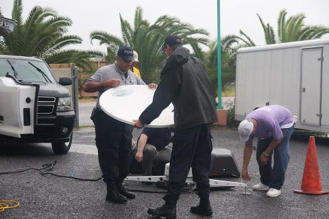 A team of technicians and a satellite dish. The Thai for "a team of technicians and a satellite dish" is "ทีมช่างและจานดาวเทียม". A team of technicians and a satellite dish. The Thai for "a team of technicians and a satellite dish" is "ทีมช่างและจานดาวเทียม".